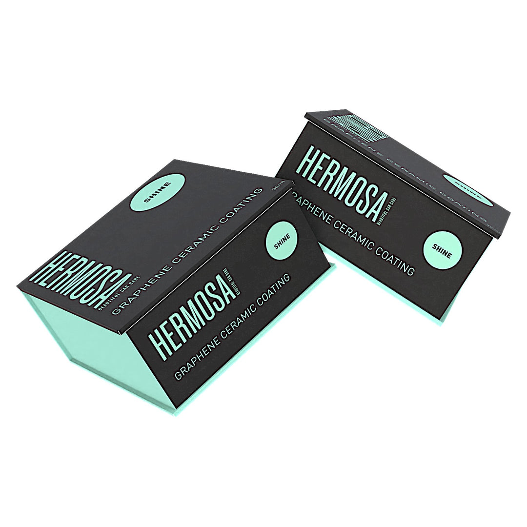 Two boxes of Hermosa Graphene Ceramic Coating with mint and black design.
