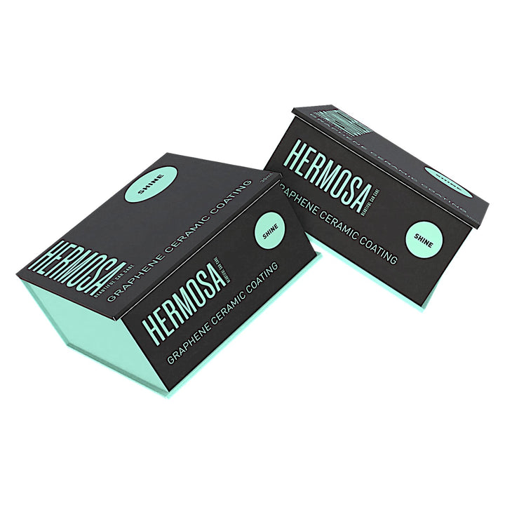 Two boxes of Hermosa Graphene Ceramic Coating with mint and black design.