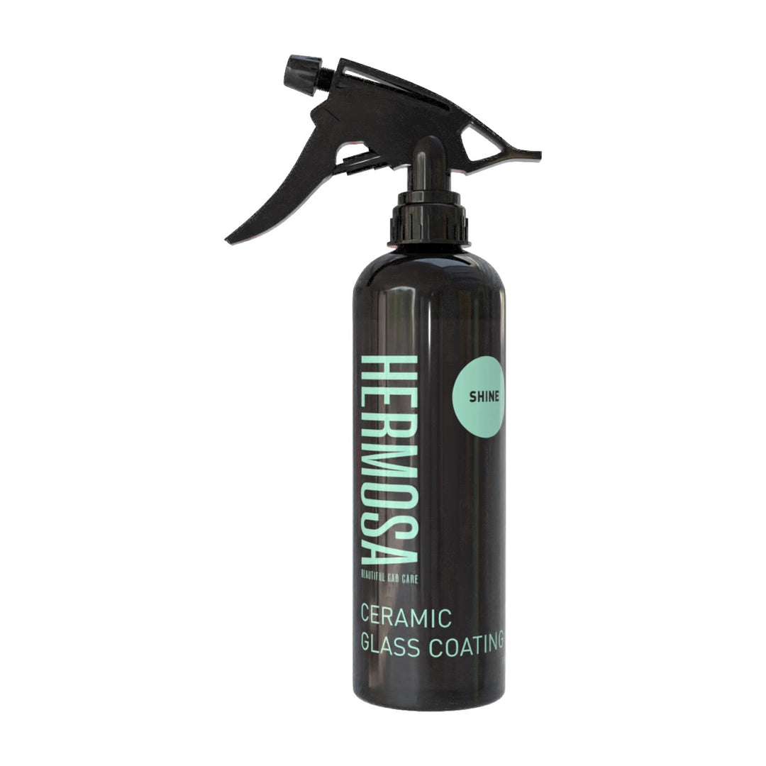 Spray bottle of Hermosa Ceramic Glass Coating with a black nozzle and a sleek design