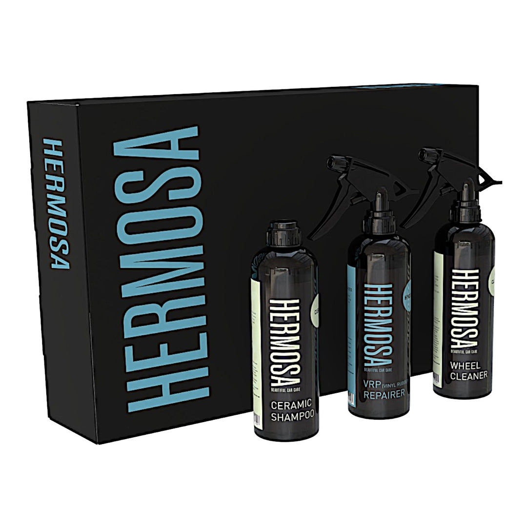 Hermosa car care set with shampoo, repairer, and wheel cleaner in black bottles.