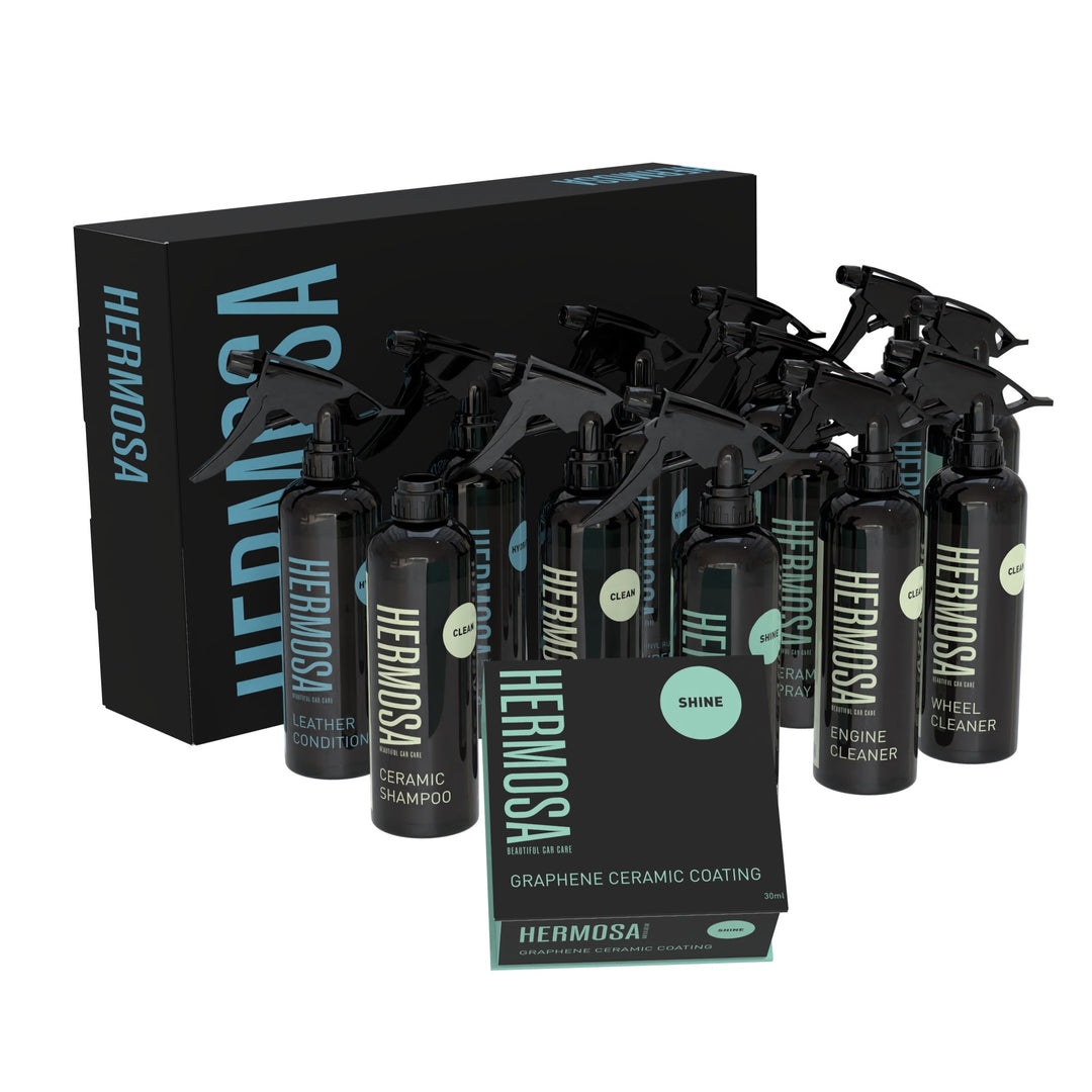 Hermosa car care product set including various cleaners and ceramic coating in black spray bottles.